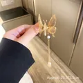 Golden butterfly hair clip with long tassels and pearls, measuring 20.3x5.5cm - Butterfly Tassel Style / Gold