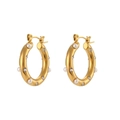 Golden chunky hoop earrings featuring pearl and zircon inlay on a white background - Large Gold Hoop - Pearl Zirconia