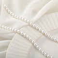 Strand of high-gloss white natural shell pearls on a textured ceramic plate and soft fabric - Round Beads / 6mm (1 Strand/Approx. 40cm/70pcs) / Artificial Pearl White