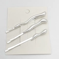 Close-up of three silver wavy metal hair clips set on a display card for styling - 3-Piece Set / Sand Silver