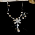 Parure collier géométrique argenté et boucles d'oreilles avec zircon et glands floraux - Goutte d'eau fleur à franges
