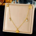 Detailed view of gold stainless steel necklace with sun pendant and teardrop crystal accents - Face Sun Multi-Pendant Design (N3491)