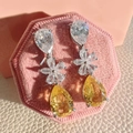 Silver drop earrings with pear-shaped yellow and clear crystals on a pink velvet box - Yellow Diamond Long Teardrop Earrings Led-101