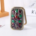 Vintage bronze folding mirror with peacock design and colorful rhinestones - Bronze Fanning Tail