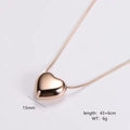 Close-up of 15mm rose gold heart pendant on snake chain showing length and weight details - Small / Rose Gold