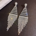 Macro shot of silver rhinestone tassel earrings featuring a cascading diamond fringe design - Silver Geometric Rhombus Grid Tassel (232)