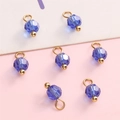 DIY jewelry kit featuring seven faceted blue glass beads with gold accents and jump rings - Royal Blue Round Bead