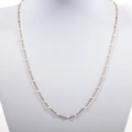 Close-up of golden stainless steel beaded chain with white enamel droplet details - Gold+White