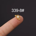 Gold stainless steel cartilage stud with rainbow cubic zirconia held on a fingertip - Gold Iridescent Opal Style (339-8#)