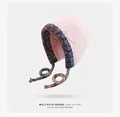 Pink faux fur knit earflap hat with blue woven trim and tassels for winter warmth - Gradient-Pink