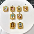 Macro shot of 8 religious portrait pendants with gold trim for DIY jewelry making - Gold Yellow