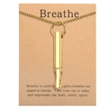 Close-up of golden mindfulness whistle necklace on Breathe positive message card - HX04 (No Card) / Gold