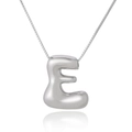 Polished silver 3D letter E pendant on a fine box chain over white background - Letter E