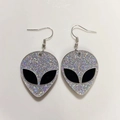 Detail of silver glitter alien head earrings with black eyes for Halloween parties - Glitter Iridescent
