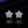 Macro shot of silver star-shaped stud earrings with sparkling pavé moissanite stones - Star Earrings Led-52