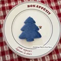 Blue plush Christmas tree ornament measuring 9x8cm on a decorative white ceramic plate - Blue Christmas Tree