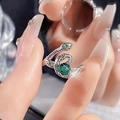 Detail of snake ring with green zircon stones and adjustable silver band scale texture - Silver Large Round Green Stone Snake