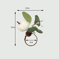 Détail d'un rond de serviette citrouille blanche avec feuilles d'eucalyptus et baies - Style Grande Citrouille Blanche et Feuille d'Eucalyptus