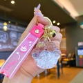 Pink cat paw liquid sand keychain with silicone handle and golden bell pendant - White Luminous Bubble Bead Cat Paw