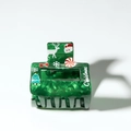 Green Christmas hair claw clip with festive holiday patterns and lettering - Green Square Santa Claus