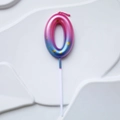 Pink and blue gradient number 0 birthday candle decorated with golden glitter on white background - Pink Lake Blue Gradient Number 0 Candle