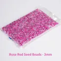 Mix of rose red and purple 3mm glass seed beads in a clear plastic retail bag - Rose Red Tones Mixed 3mm