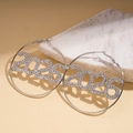 Close-up of silver hoop earrings featuring rhinestone-studded 2026 numeric pendant design - Hoop Earrings-Silver (2026)