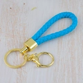 Handmade rainbow braided leather keychain in vibrant blue with gold metal ring hardware - Generation 1 Round Dragon Woven Buckle (Light Gold) / Sky Blue