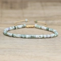 Adjustable woven bracelet featuring light green imperial stone beads and silver spacers - No.60 Lucky Stone