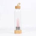 Bamboo glass water bottle featuring a natural pink rose quartz crystal column inside - Rose Quartz Bottle