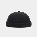 Detail of black ribbed knit dockers cap with thick folded brim and top pom pom decoration - Adjustable / Black