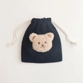 Detail of black corduroy drawstring pouch featuring a cute plush bear head applique - Black (Milk Tea Bear)