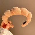 Padded beige terry cloth headband with thick twisted design and handmade tag - Tan