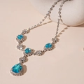 Collana vintage in argento con gemme blu mare taglio a pera e accenti di diamanti - Collana a Goccia di Cristallo Blu