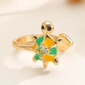 Macro shot of adjustable gold turtle ring with green enamel and clear zircon stone - Gold Enamel Sea Turtle (F37)