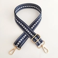 Detail of adjustable dark blue nylon wide strap with white arrow pattern and gold hooks - Blue Silver Buckle