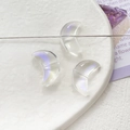 Macro shot of three crescent moon glass beads with a colorful aurora gradient effect - Transparent Iridescent Crescent (13# 10Pcs Price)