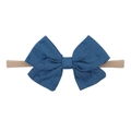 Close-up of dark blue textured fabric bow headband with soft nude nylon elastic band - Dark Blue