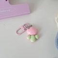 Close-up of pink flower keychain with shiny resin finish and pink lobster clasp - Pink