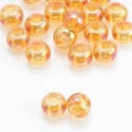 Vista macro di perle di vetro ambrato 8x10mm con finitura AB cangiante e foro centrale - 8X10mm / Oro Rosa Rosso