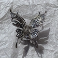 Detailed view of silver butterfly metal hair claw with rhinestones on textured paper - No. 6 Large 3D Butterfly with Rhinestones (Silver)