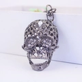 Stylish gunmetal crystal skull keychain with rhinestone inlay on a polished metal ring - Gunmetal