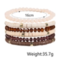 Detail view of 6-piece bohemian beaded bracelet set with 16cm circumference and 35.7g weight - Earth Brown Purple