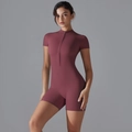 Close-up of the zipper stand collar and elastic fabric on this slim yoga bodysuit - S / Burgundy