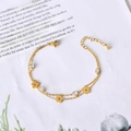 Dubbellaagse gouden titanium armband met bloembedeltjes en hartvormige zirkonia-accenten - Bloem