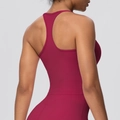 Detail view of the racerback design on this burgundy high-elasticity yoga sports bra - Carmine