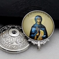 Macro view of silver religious pendant head with saint icon and engraved metal base - Silver-9 (Saint Parascheva)
