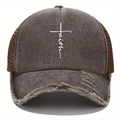 Close-up detail of vintage washed baseball cap with faith print and distressed brim - Coffee
