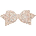 Macro detail of high-quality glitter fabric on champagne and peach bow accessory - Snow Bud White