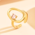 Gold hollow geometric stainless steel ring with a round purple zircon stone setting - Gold with Light Pink Stone